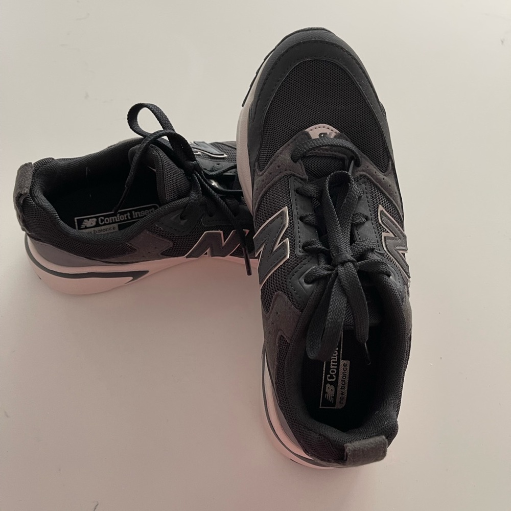 Brand new, never worn New Balance running shoes. Factory orthotic insole.